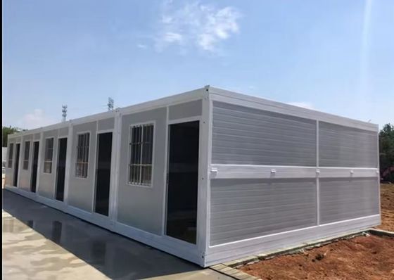 Ατσάλινη πόρτα αναδιπλούμενο κοντέινερ σπίτι επίπεδο πακέτο προκατασκευασμένο 20ft 40ft